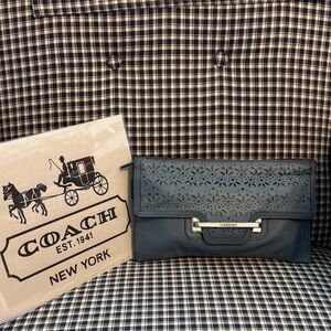 Coach Taylor eyelet clutch in blue